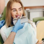 a woman is getting dental treatment